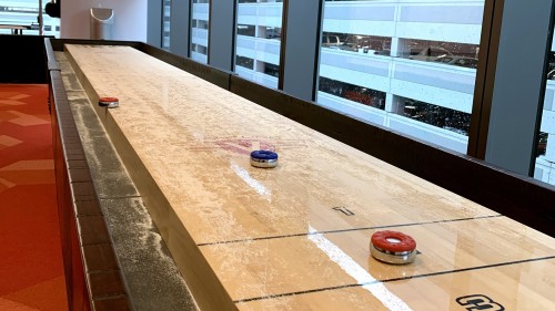 The recreational room in SPIRIT ONE features shuffleboard.