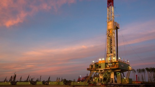 A drilling rig operates in the liquids-rich Montney play in Canada.